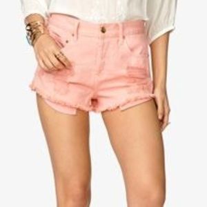 Pink distressed denim shorts